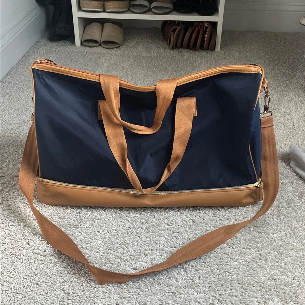 Stylish Navy and Tan carry on luggage with bottom storage